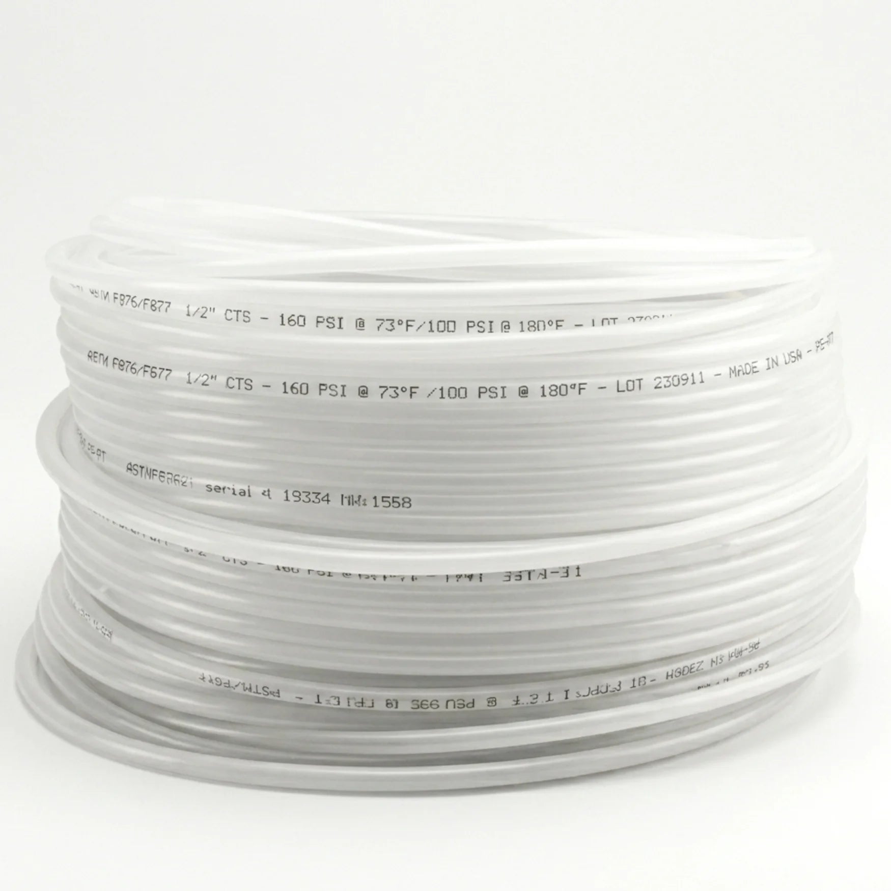 Coiled white hose on a white background