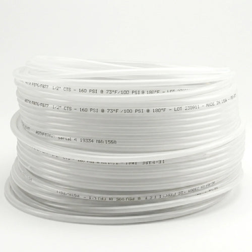 Coiled white hose on a white background